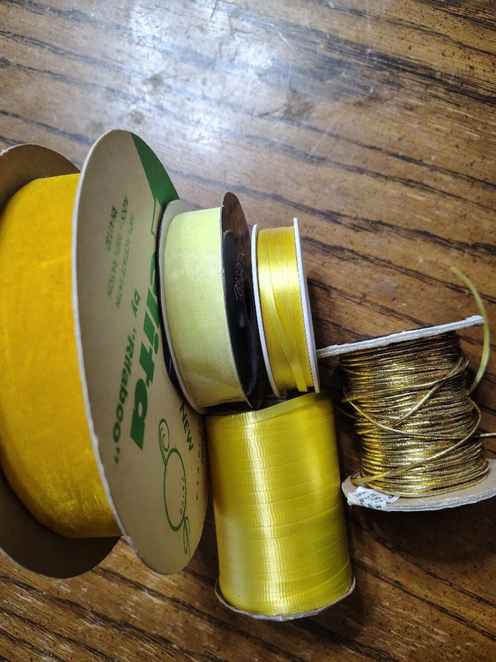 assortment of five yellow color ribbons